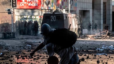 A demonstrator clashes with security forces. AFP
