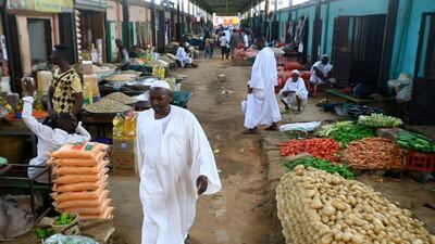 Sudanese vendors sell vegetables in the central market of Khartoum. The Paris Club of official creditors has agreed to cancel $14 billion owed by Sudan. AFP