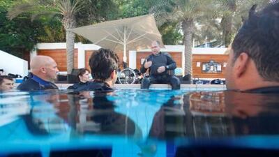 Fraser Bathgate teaches dive instructors the correct exit technique for diabaled divers in the Disabled Dive Instructor course held at The Pavilion Dive Center at Jumeirah Beach Hotel.