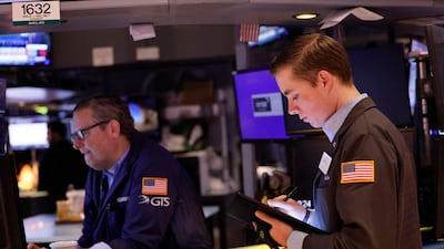 Traders at the New York Stock exchange. The Nasdaq 100 took its biggest step since May. AFP