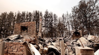Debris of a burnt house are seen in Sarsfield, Australia. Getty