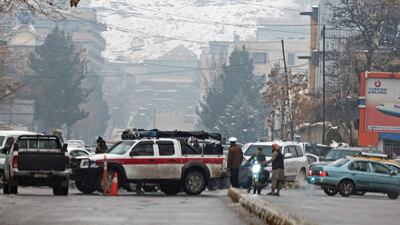 Taliban security forces block a road after a suicide blast near Afghanistan's foreign ministry at the Zanbaq Square in Kabul on January 11, 2023. - A suicide bomber detonated a device on January 11 near Afghanistan's foreign ministry in the capital, causing more than 20 causalities, an AFP staff member said. (Photo by Wakil KOHSAR / AFP)