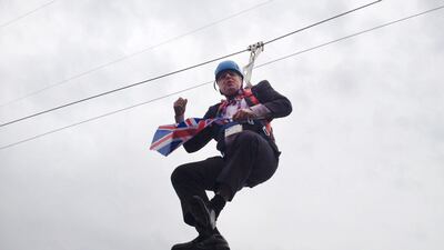 Boris Johnson dangles from a zip wire after getting stuck during a promotional event for the London Olympics on August 1, 2012. Barcroft Media / Barcoft Media via Getty Images