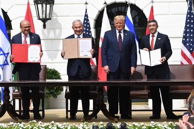 Sheikh Abdullah bin Zayed, UAE Minister of Foreign Affairs and International Co-operation, with Bahraini Foreign Minister Abdullatif Al Zayani, left, Israeli Prime Minister Benjamin Netanyahu, second left, and US President Donald Trump at the signing of the Abraham Accords at the White House on September 15, 2020. AFP