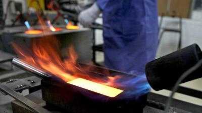 Kaloti's new facility at the DMCC will have the capacity to refine as much as 1,400 tonnes of gold and 600 tonnes of silver per year as well as other precious metals. Above, gold is being refined at the company's plant in Sharjah. Delores Johnson / The National
