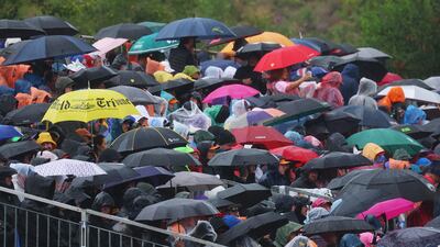 Fans take cover from the rain at Spa-Francorchamps. Getty Images