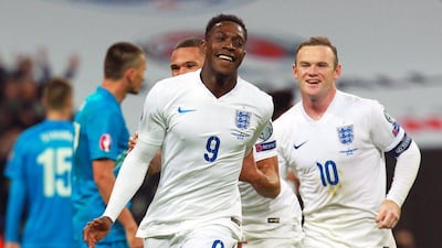 England's Danny Welbeck celebrates after scoring one of his two goals in a 3-1 Euro 2016 qualifying win over Slovenia on Saturday night. Sean Dempsey / EPA / November 15, 2014