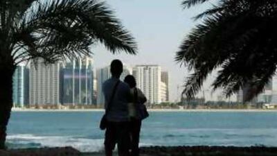 Tourists explore Heritage Village in Abu Dhabi: the Emirates' allure to visitors unlikely to change, experts say.