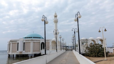 The Floating Mosque in Jeddah, Saudi Arabia, is connected to the shore by a low-walled walkway. Getty Images