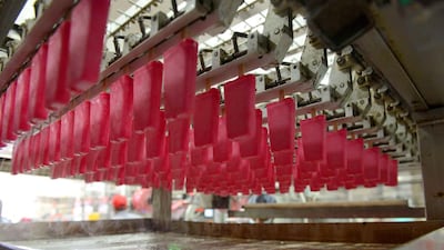 A production line for popsicles are pictured at the Havmor plant at Naroda near Ahmedabad in India. Havmor produces some 200,000 litres of ice cream daily from its two factories during the peak summer season when demand for their products are high. Sam Panthaky / AFP