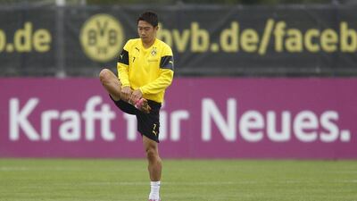 Shinji Kagawa trains with Borussia Dortmund on Tuesday after arriving in from Manchester United during the summer transfer window. Ina Fassbender / Reuters / September 9, 2014