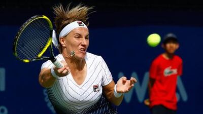 Svetlana Kuznetsova stretches to return a volley from Francesca Schiavone at the Dubai Duty Free Championships yesterday.