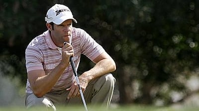 The Welshmen Bradley Dredge lines up a putt during his third round.
