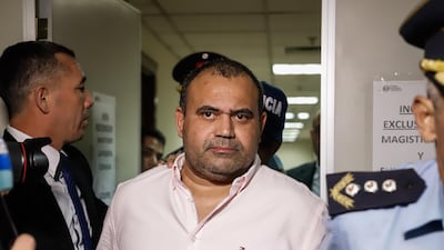 Wilmondes Sousa Lira, indicated by Ronaldinho, as provider of false documents, leaves the Palace of Justice after appearing before Judge Mirko Valinotti. EPA