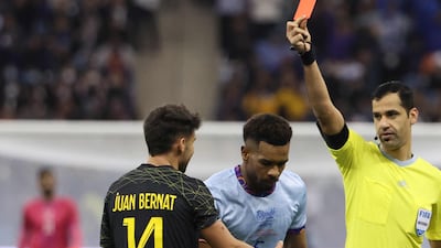 PSG defender Juan Bernat is shown the red card by Qatari referee Abdulrahman al-Jassim. AFP