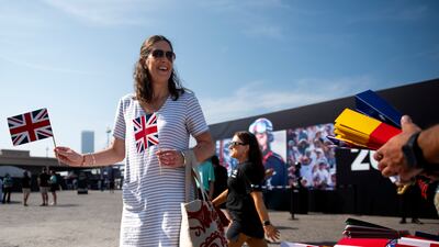 Spectators buy flags to cheer on their teams.