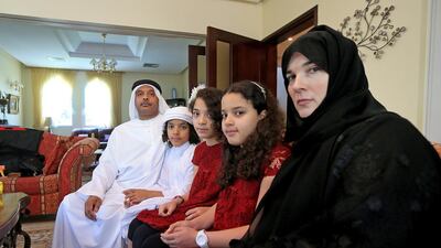 Emirati Ghalib Al Maskeri, left, with his family, wife Liz, right, and children, from left, Mohammed, Aliya and Yasmine, is hoping the kindness and generosity inspired by the holy month will help him to pay to send his ailing father-in-law back to the UK. Ravindranath K / The National