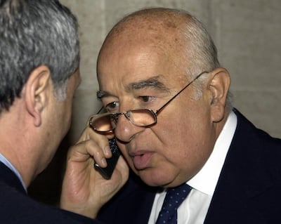Lebanese-Brazilian Joseph Safra speaks on his mobile phone as he arrives at a courthouse in Monaco for the start of the trial of former US soldier Ted Maher, accused of an arson attack that killed his brother Edmond. AFP