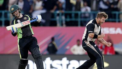 New Zealand’s Corey Anderson, right, celebrates the wicket of Australia’s Nathan Coulter-Nile during their ICC World Twenty20 match at the HPCA stadium in Dharamshala. Tsering Topgyal / AP Photo