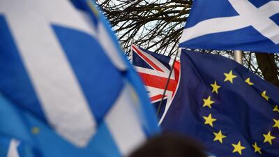 Pro-Union activists wave the Union Jack flag in the midst of the Scottish Saltire and EU flags during a demonstration recently. AFP