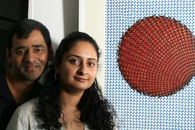 Pakistani artists Aisha Khalid and Imran Qureshi with their works at the HK Arts Centre at Experimental Gallery in Hong Kong. Getty