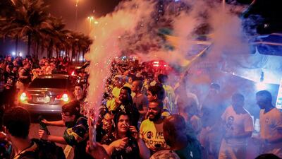 Supporters of Jair Bolsonaro, celebrate in front of the candidate's house in Rio de Janeiro. EPA