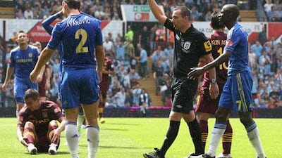 Referee Kevin Friend sends off Chelsea's Branislav Ivanovic during the 2012 Community Shield