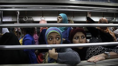 Women look from an all-female car at Al Shohadaa (Martyrs) metro station.