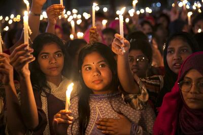 A candlelight vigil in Dhaka marking Women's Day. Bangladesh has achieved outstanding improvements in quality of life indicators like female literacy. Getty Images