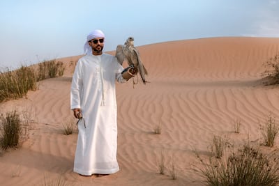 Falconer Ammar bin Humaid Al Marri says the hunting trips are also about connection and camaraderie. Victor Besa / The National