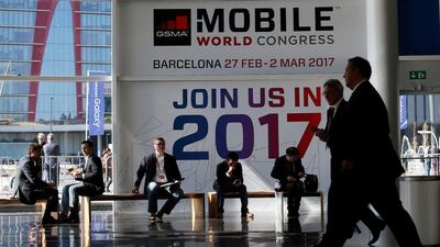 Participants arrive early for the Mobile World Congress in Barcelona, Spain. Albert Gea / Reuters