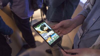 People examine Google’s new Pixel smartphone. Ramin Talaie / Getty