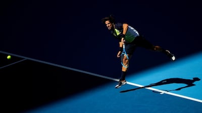 Feliciano Lopez of Spain hits a return against Borna Coric of Croatia during their Men's Singles first round match of the 2018 China Open. Lintao Zhang/Getty Images