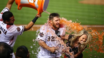 Arizona Diamondbacks pinch-hitter Jeff Mathis and Fox Sports TV reporter Kate Longworth are doused with gatorade by teammate David Peralta after hitting the game winning hit in the fifteenth inning against the Los Angeles Dodgers at Chase Field, Arizona. Mark J. Rebilas / Reuters