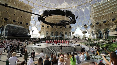 Russian folk dancers perform during Russia's National Day ceremony at Expo 2020 Dubai. The world's fair has helped to spur economic activity in the country. AP