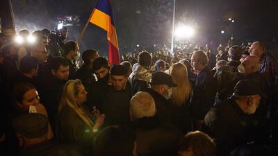 Protestors gather outside the Armenian parliament building after the announcement of a peace deal in the war between Armenia and Azerbaijan. Getty Images