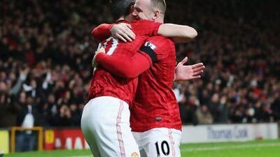 Robin van Persie, left, has been doing the bulk of the scoring and, though Wayne Rooney, right, has only one goal so far, Manchester United are top of the table with one-third of the games played.