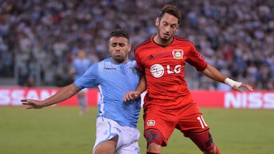 Mauricio of Lazio challenges Bayer Leverkusen's Hakan Calhanoglu during their Champions League play-off round first leg match on Tuesday. Maurizio Brambatti / EPA