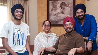 Three generations of Pujjis in Dubai: Narindra Singh Pujji with his grandson Kabir, left, daughter-in-law Ekta and son Mandeep. Victor Besa / The National