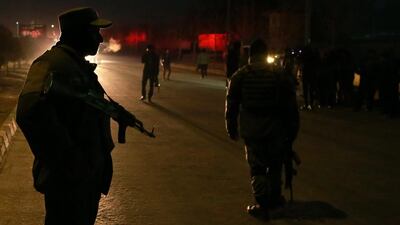Afghan security officials stand guard outside the parliament after twin bombings that targeted the Parliament building in Kabul. Hedayatullah Amid / EPA