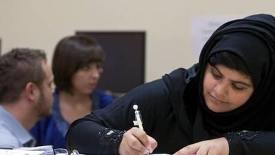 Jawahen Abdullah fills a worksheet in the programme to help high-school graduates prepare for the American University of Sharjah.