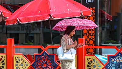 The sun shines through after a brief downpour in central Abu Dhabi. Victor Besa / The National