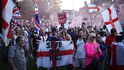 Protesters calling for the closure of The Bell Hotel in Epping, Essex. AFP