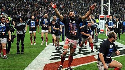 Sebastien Chabal, centre, the France lock, celebrates with his teammates after they won their first Six Nations Grand Slam since 2004 on Saturday with a 12-10 victory over England at the Stade de France in Paris. The team spirit shown here was indicative of their entire campaign as they won all five games.