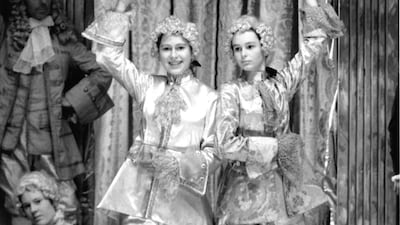 Queen Elizabeth as 'Prince Florziel' posing with another actress in the Christmas production of 'Cinderella' at Windsor Castle in 1941. Getty Images