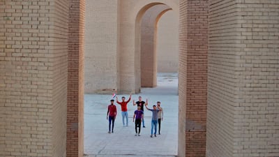 People celebrate at the archaeological site of Babylon, Iraq on Friday celebrated the UNESCO World Heritage Committee's decision to name the historic city of Babylon a World Heritage Site in a vote held in Azerbaijan's capital, years after Baghdad began campaigning for the site to be added to the list. AP