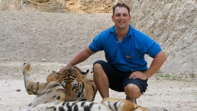 Armed with only a toilet brush, Rob Punton says he can make a better life for big cats kept in private collections in the UAE.