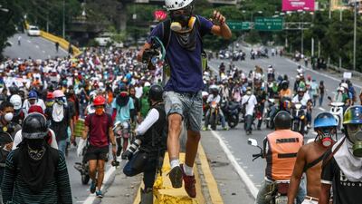 Opposition sympathisers participate in a protest against the Government in Caracas, Venezuela. Policemen broke up the protest with tear gas and blocked the different marches in several cities of the country. Christian Hernandez / EPA