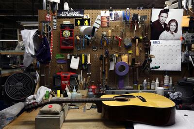A guitar a workstation at CF Martin and Co. Jacqueline Larma/AP