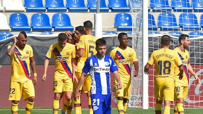 Barcelona's players celebrate their second goal scored by Lionel Messi. AFP